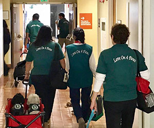 Volunteers walking down hall in a group